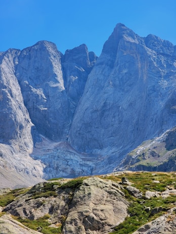A stunning mountain landscape with a clear blue sky.
