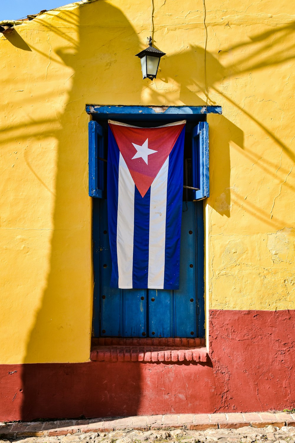 a blue and red door with a white star on it