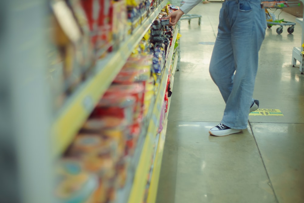a man is shopping in a grocery store