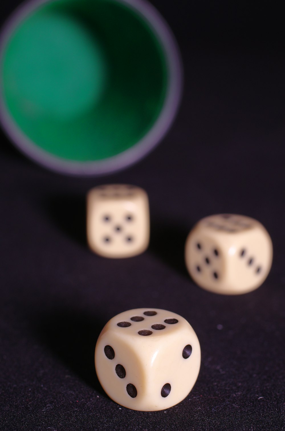 three white dices sitting on top of a table