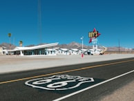 a route 66 sign on the side of a road