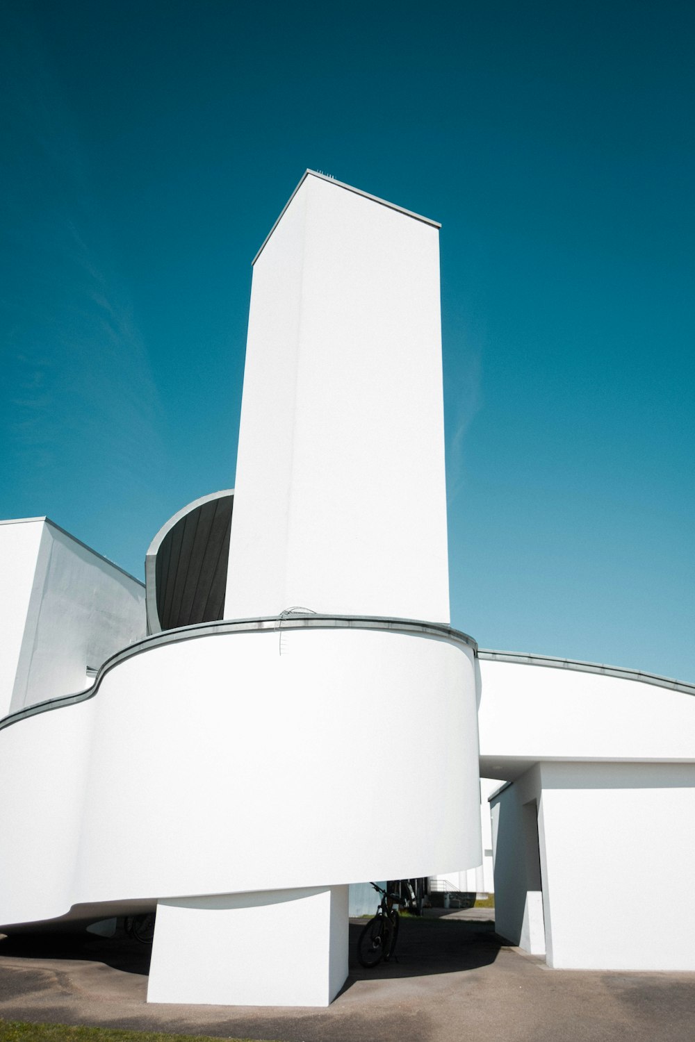 a large white building with a circular entrance