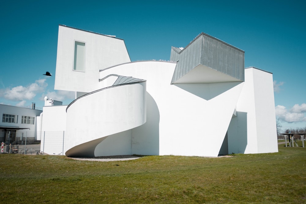 a large white building with a spiral staircase