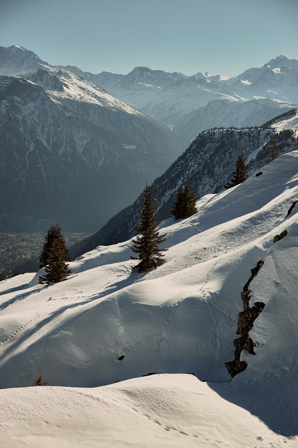 a person riding skis down a snow covered slope