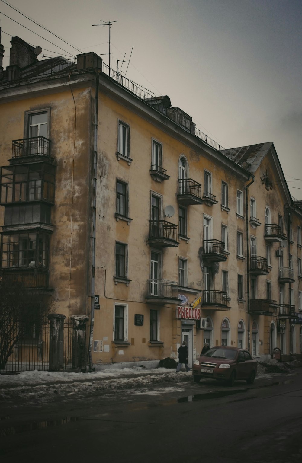 a car parked in front of an old building