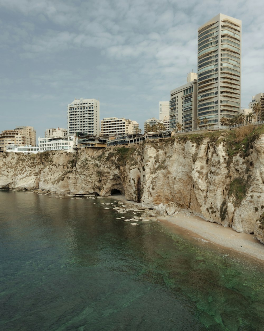 a large body of water next to a city