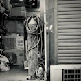 Stack of old air conditioners ready for recycling at a frostcycle facility.