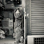 Stack of old air conditioners ready for recycling at a frostcycle facility.