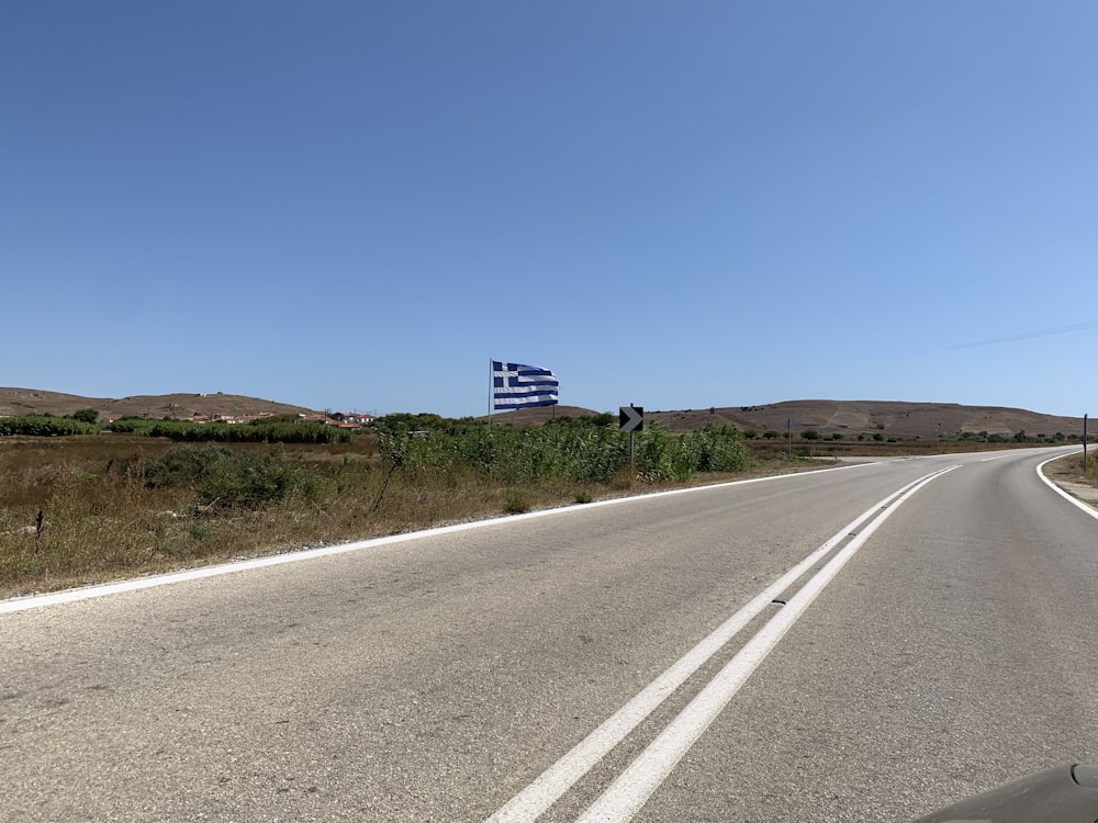 a road with a flag on the side of it