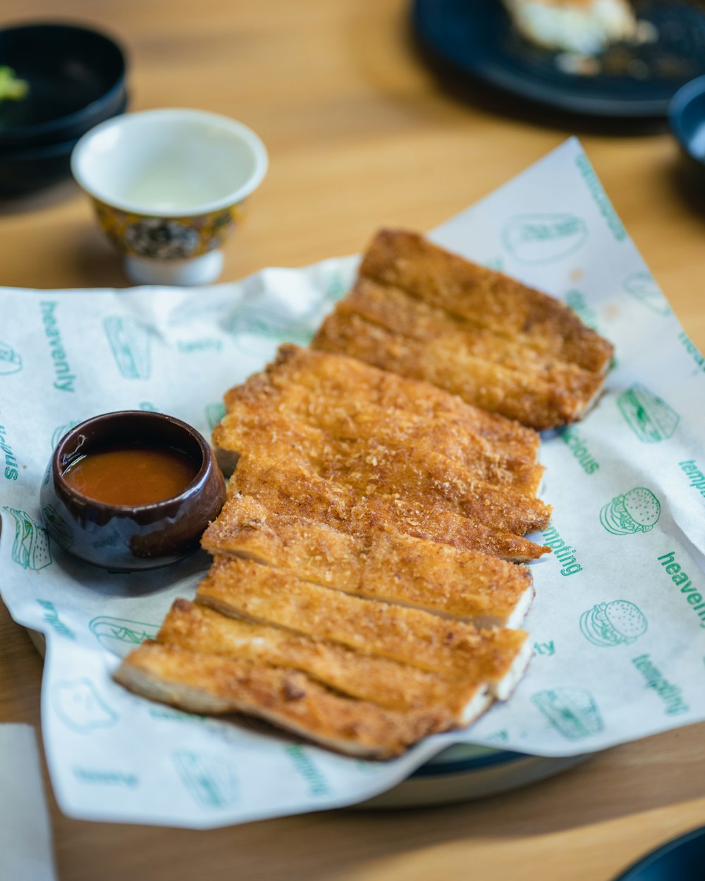 a plate of fried food with dipping sauce