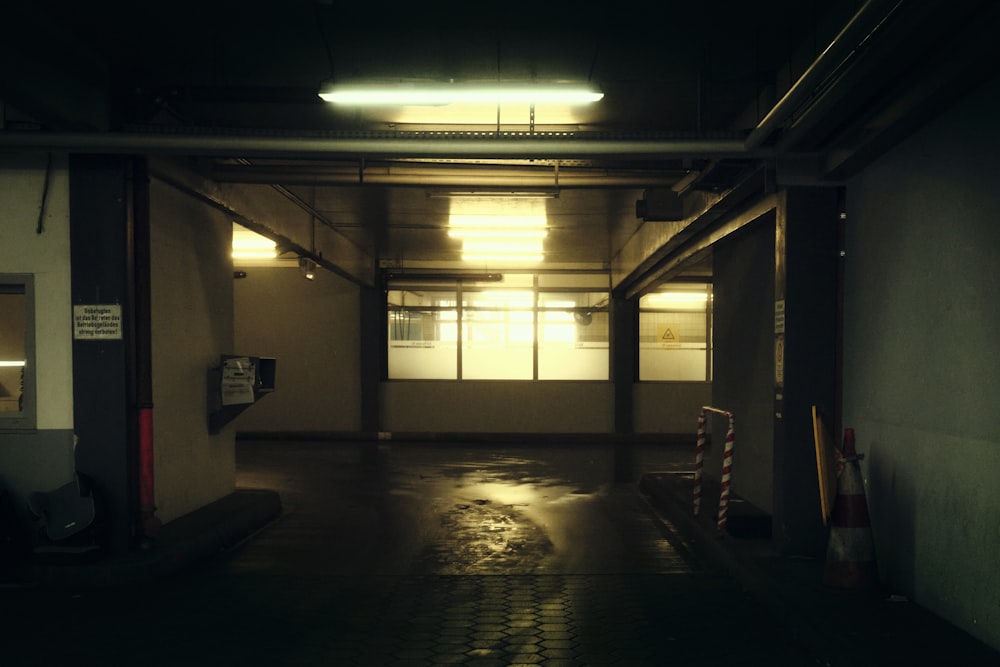 a dimly lit parking garage with no one in it