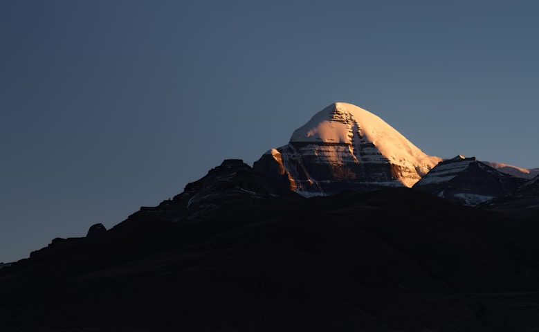 a snow covered mountain with a sky background