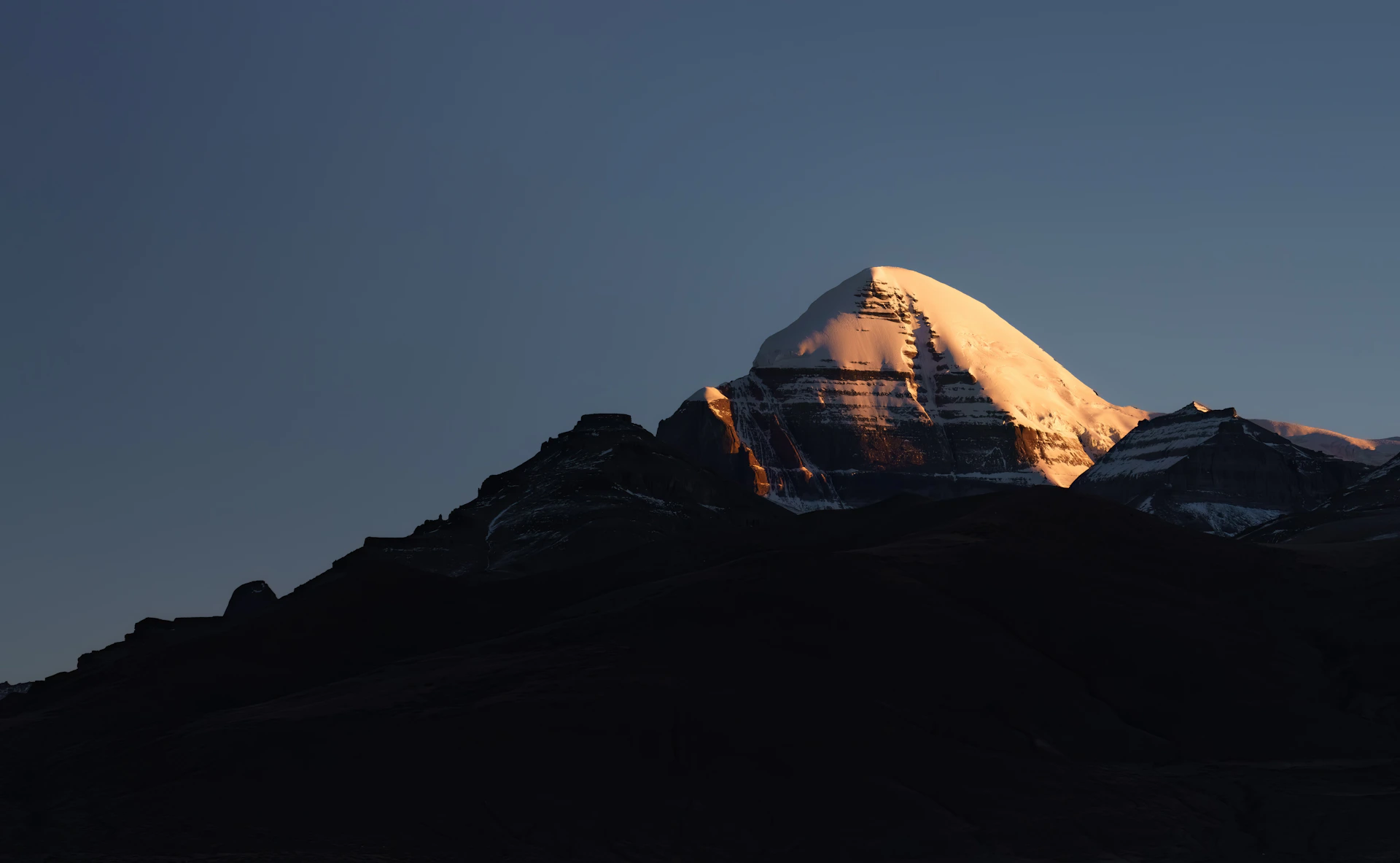 a snow covered mountain with a sky background