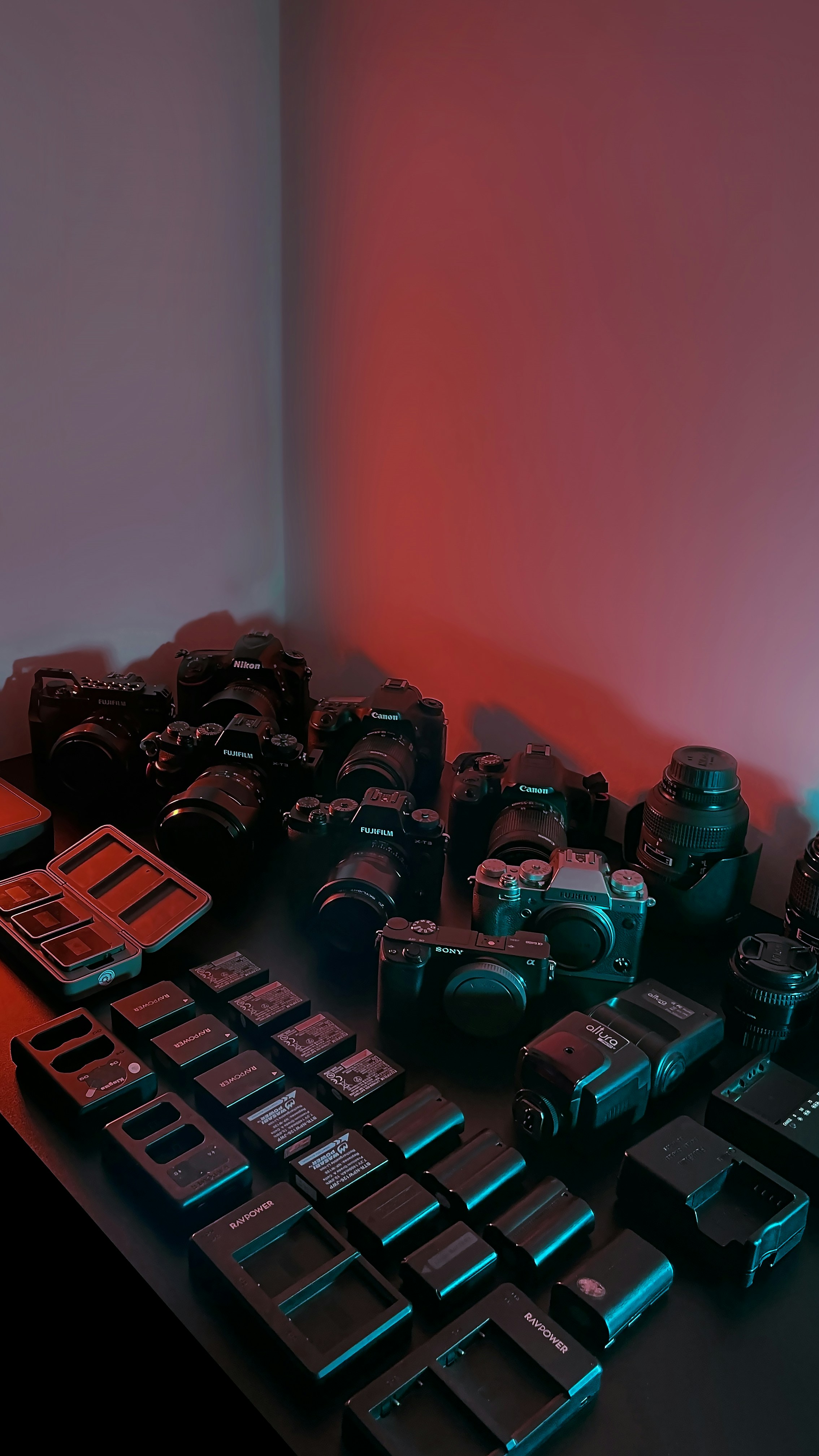 Vibrant photography collection grid, dark studio environment, dramatic colored lighting, deep shadows, moody atmosphere