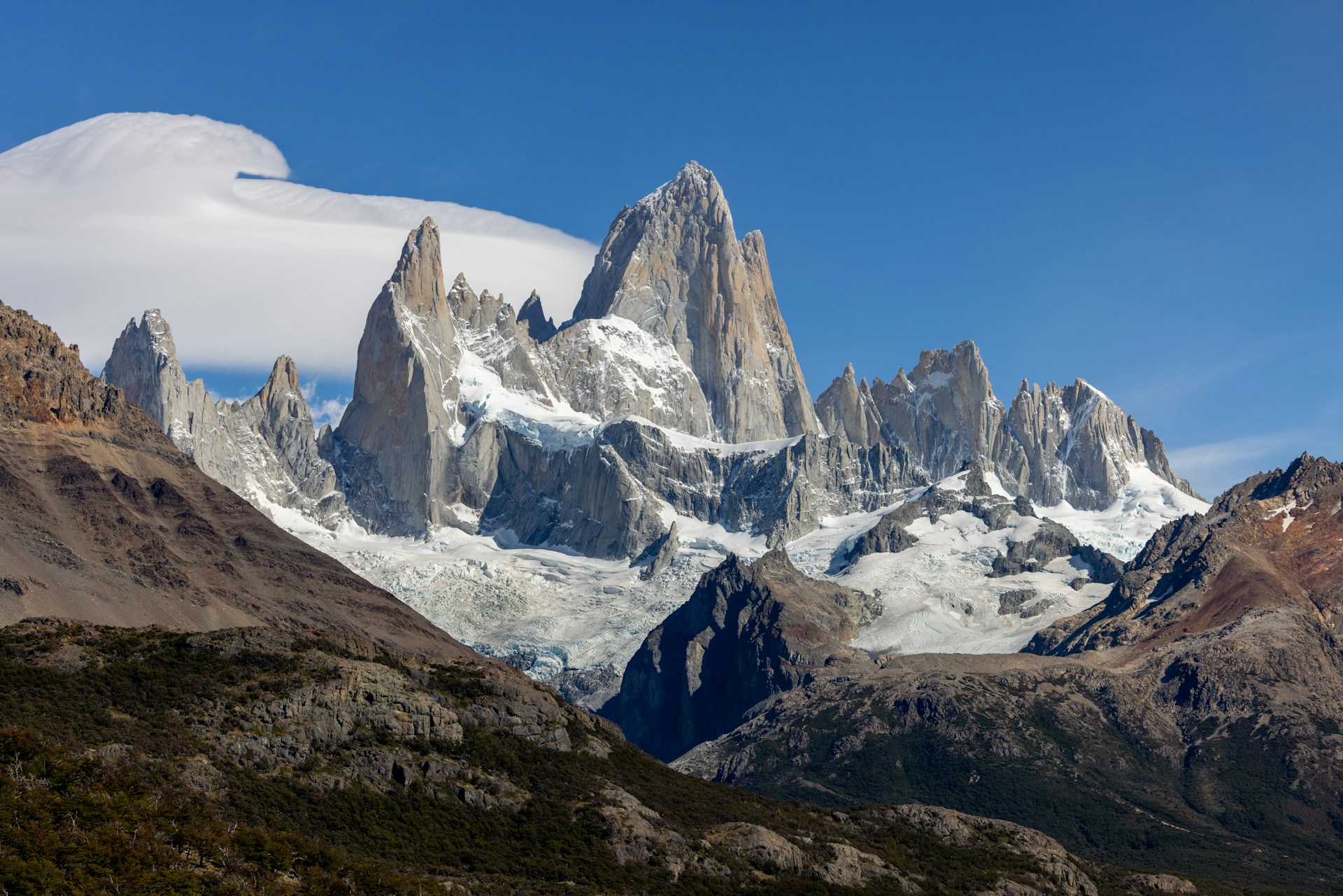 a group of mountains with snow on them