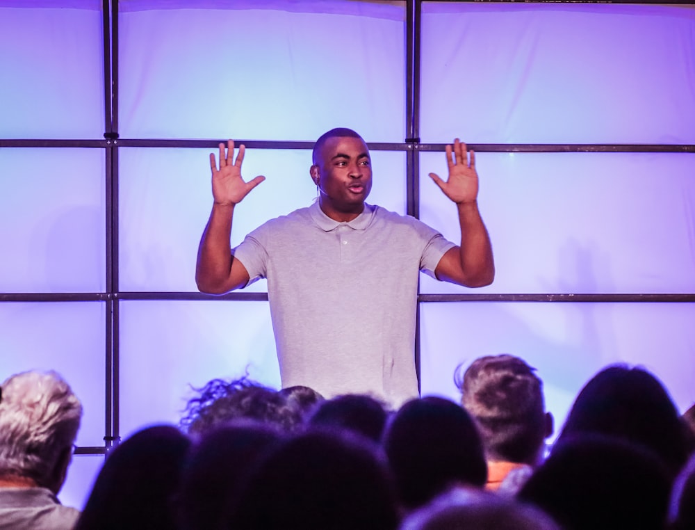 a man standing in front of a crowd of people