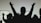 Silhouettes of people raising their hands against a light background, conveying a sense of unity or celebration.
