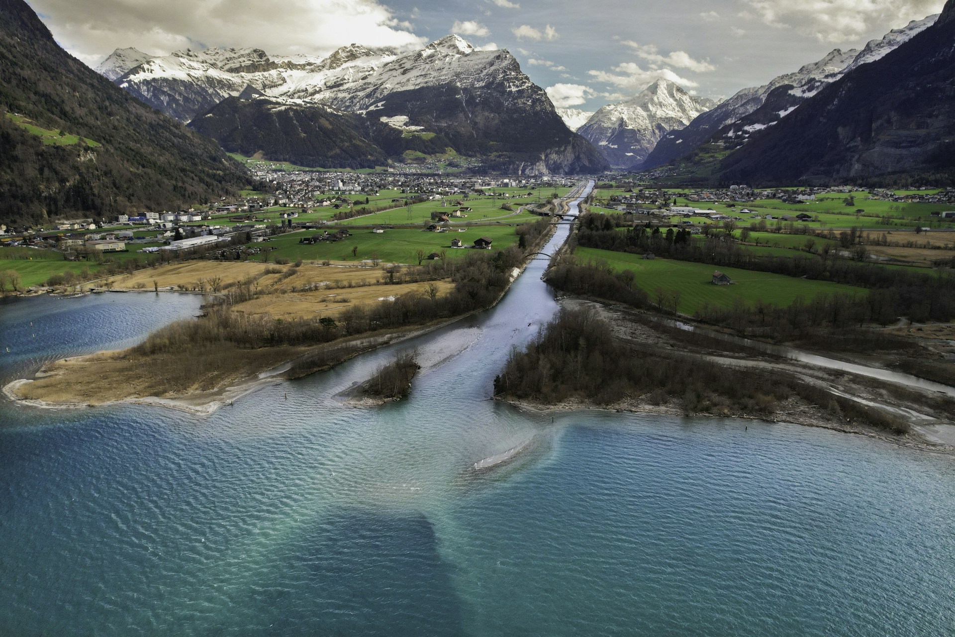 a river running through a lush green valley