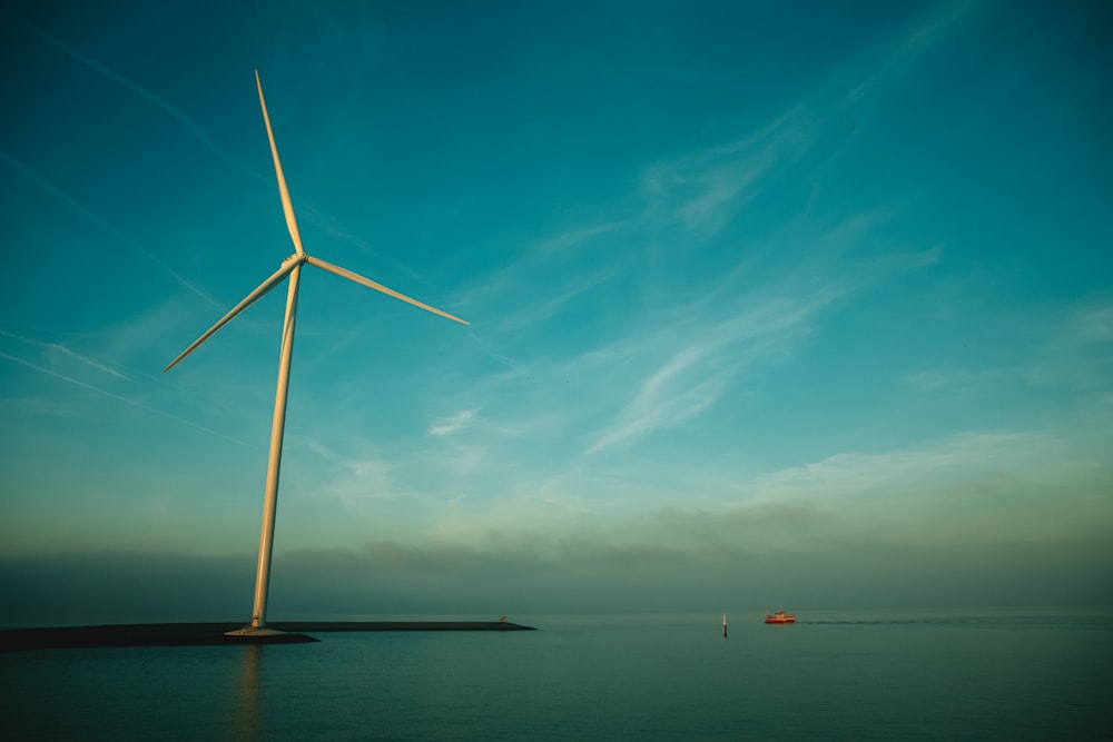 a wind turbine on a body of water