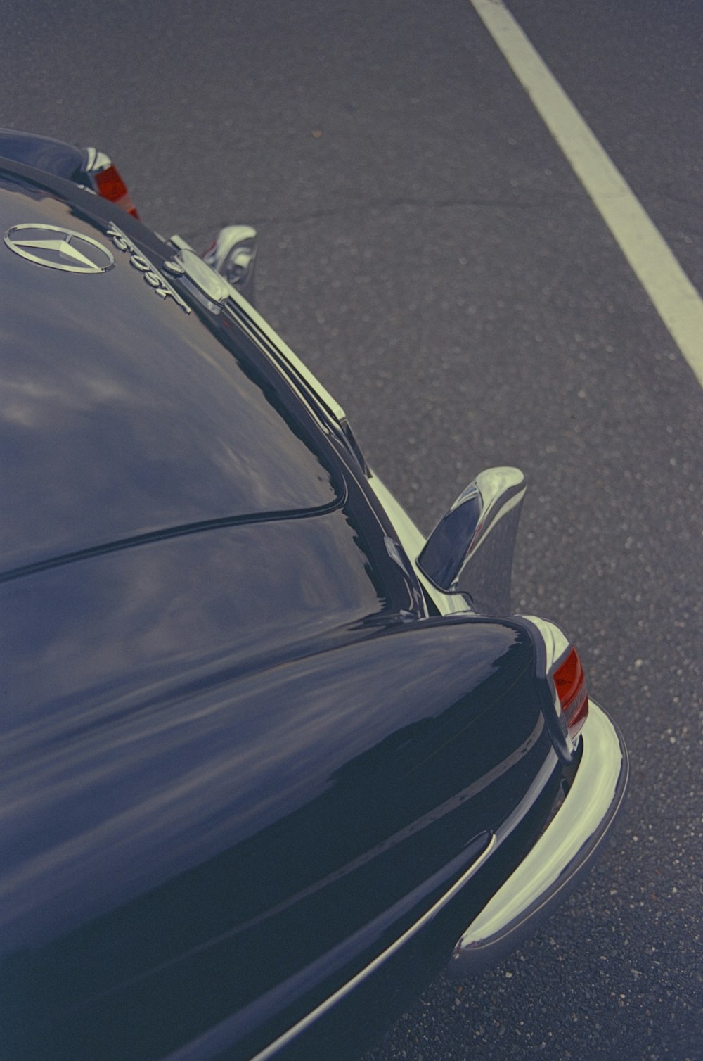 a close up of a car parked in a parking lot