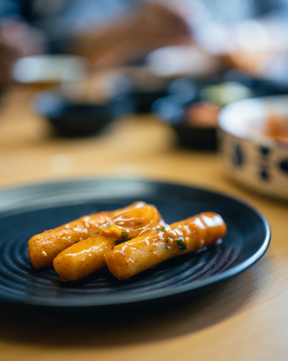 a plate of food on a wooden table