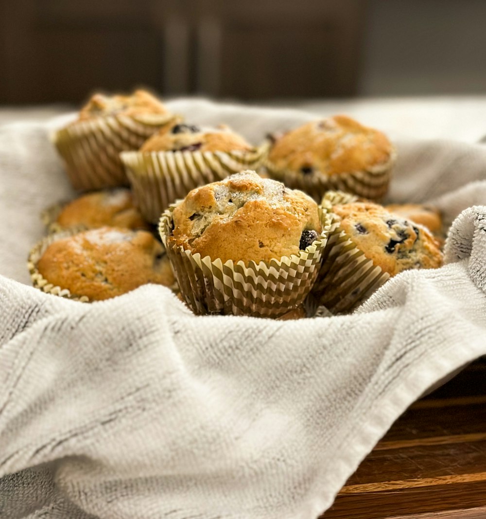 a bunch of muffins sitting on top of a table