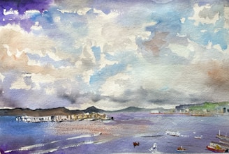 A watercolor painting features a serene seascape with a dramatic sky, filled with swirling clouds in shades of purple, blue, and white. Below, a calm water body reflects the sky, with small boats scattered across the surface. The distant shoreline is dotted with a few buildings and greenery, suggesting a coastal scene.