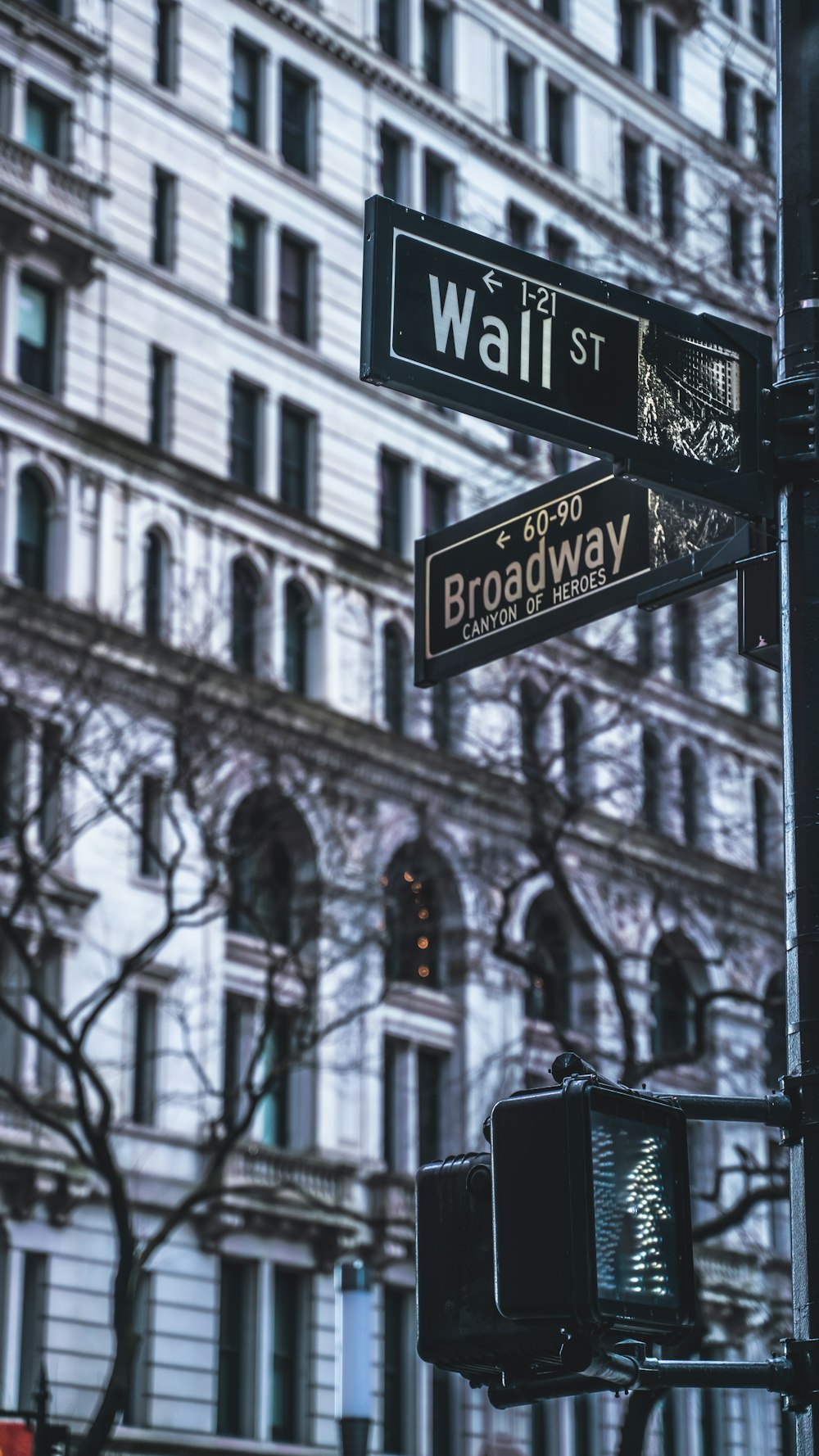 a traffic light and street sign in front of a building