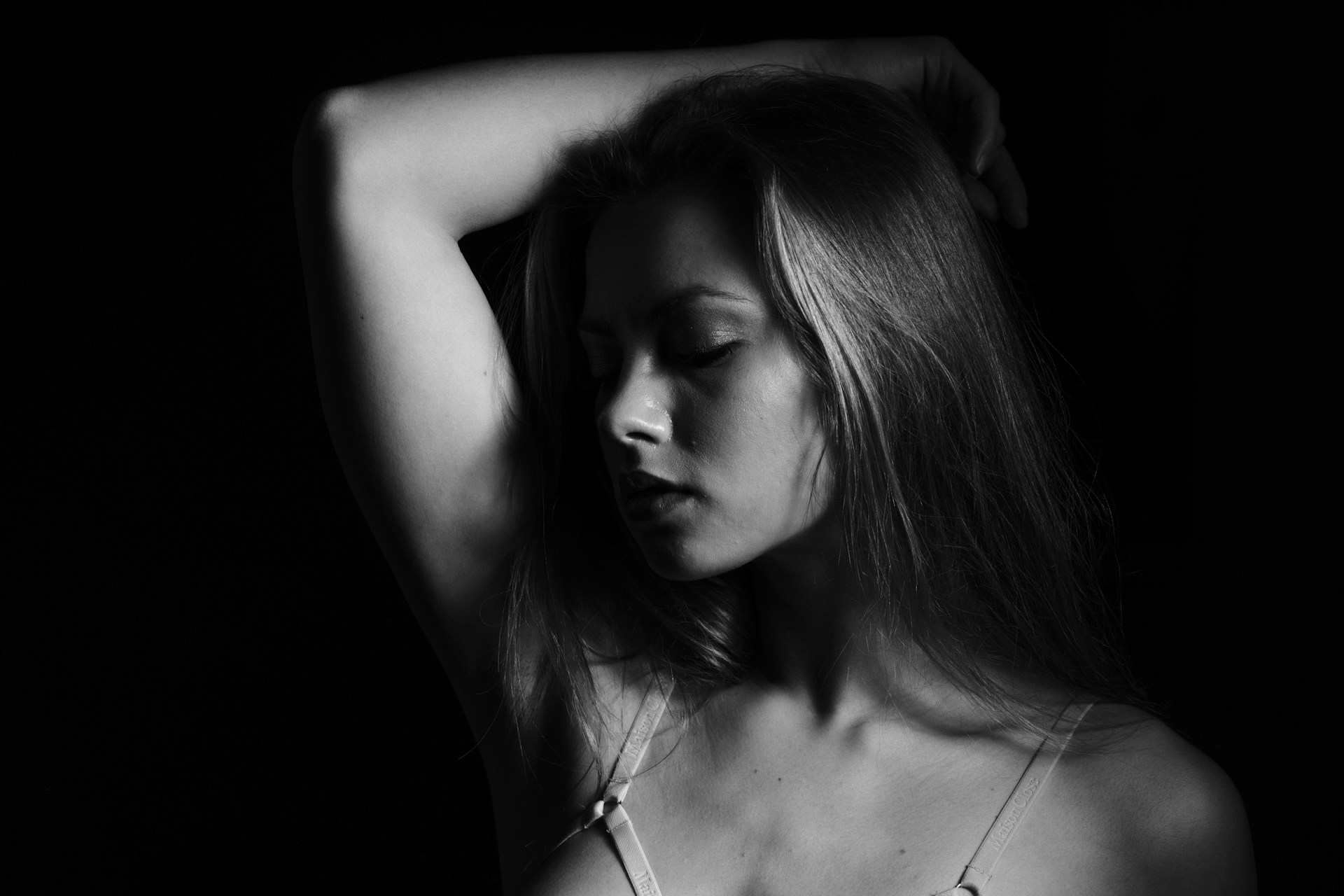 a black and white photo of a woman with long hair