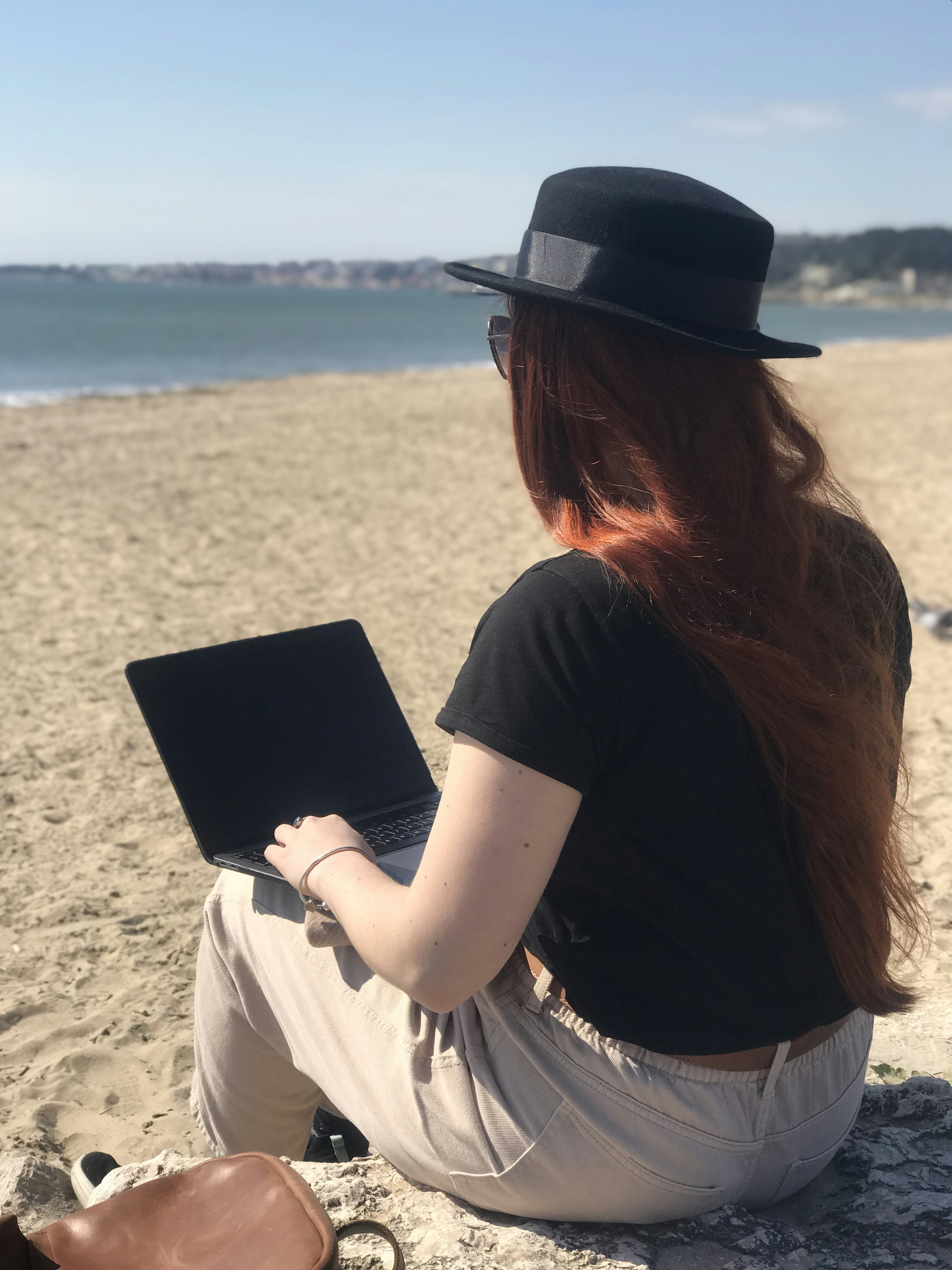Remote worker planning international travel on laptop