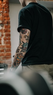 a man with a tattoo on his arm