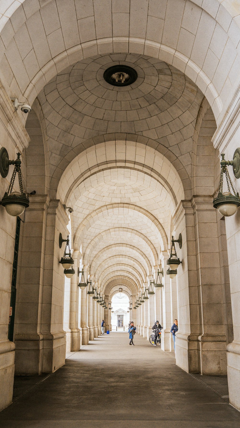 a couple of people that are walking down a walkway