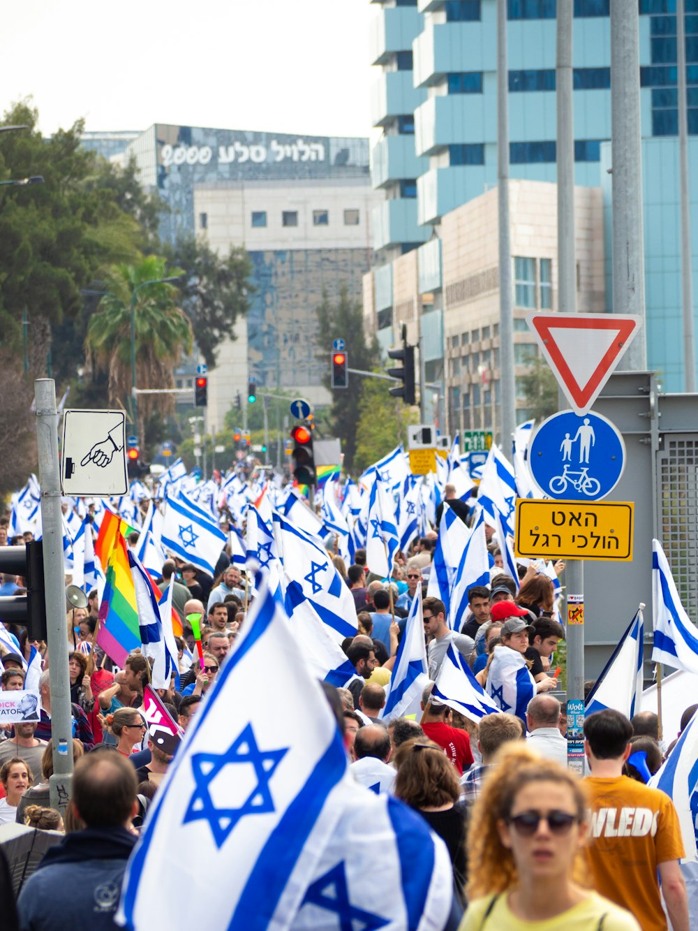 a large group of people walking down a street