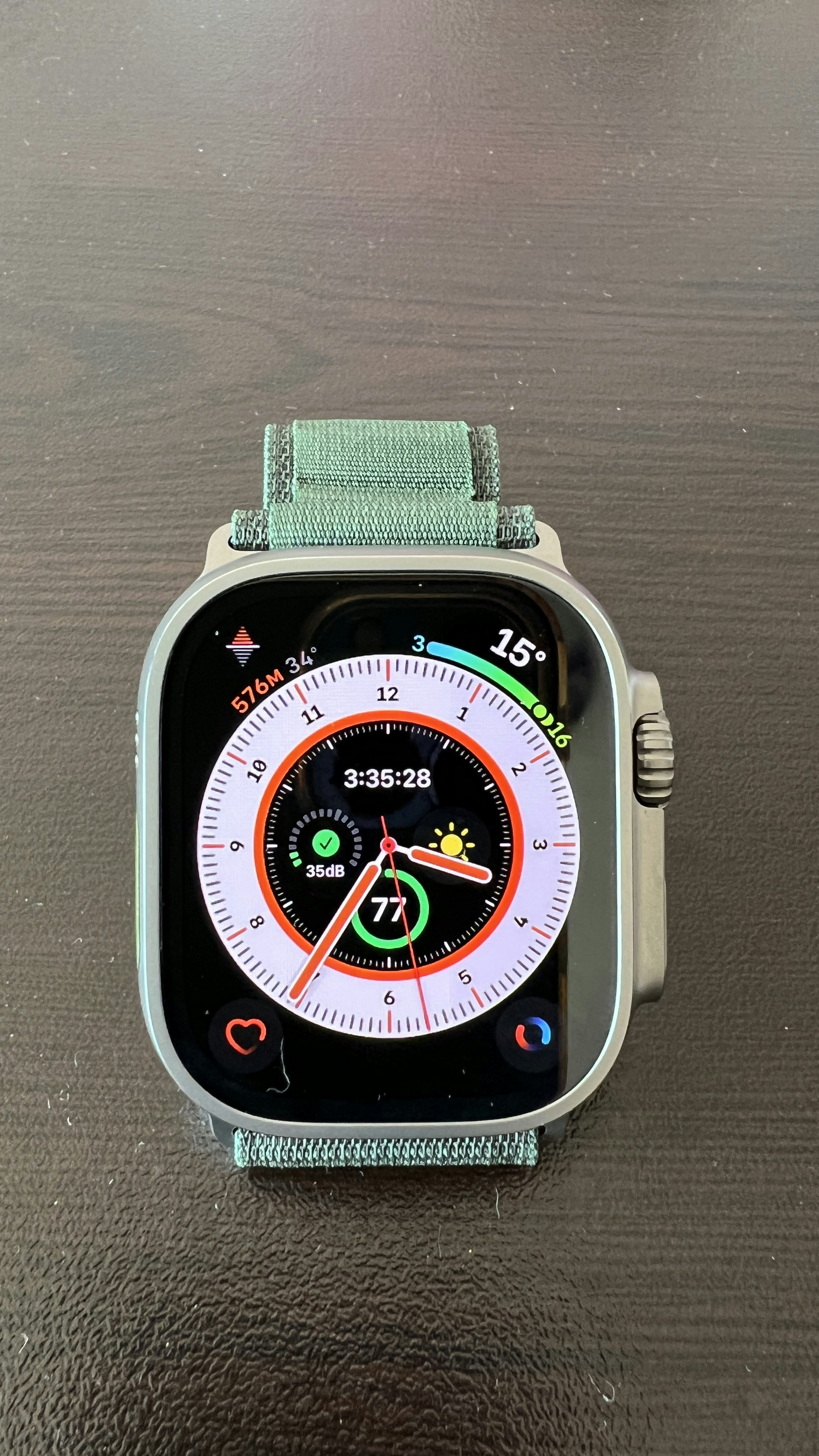 Samsung smartwatch with green band showing health dashboard