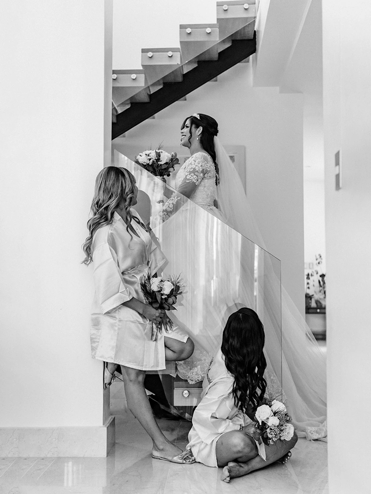A bride adjusting her flowers while getting ready on her wedding morning