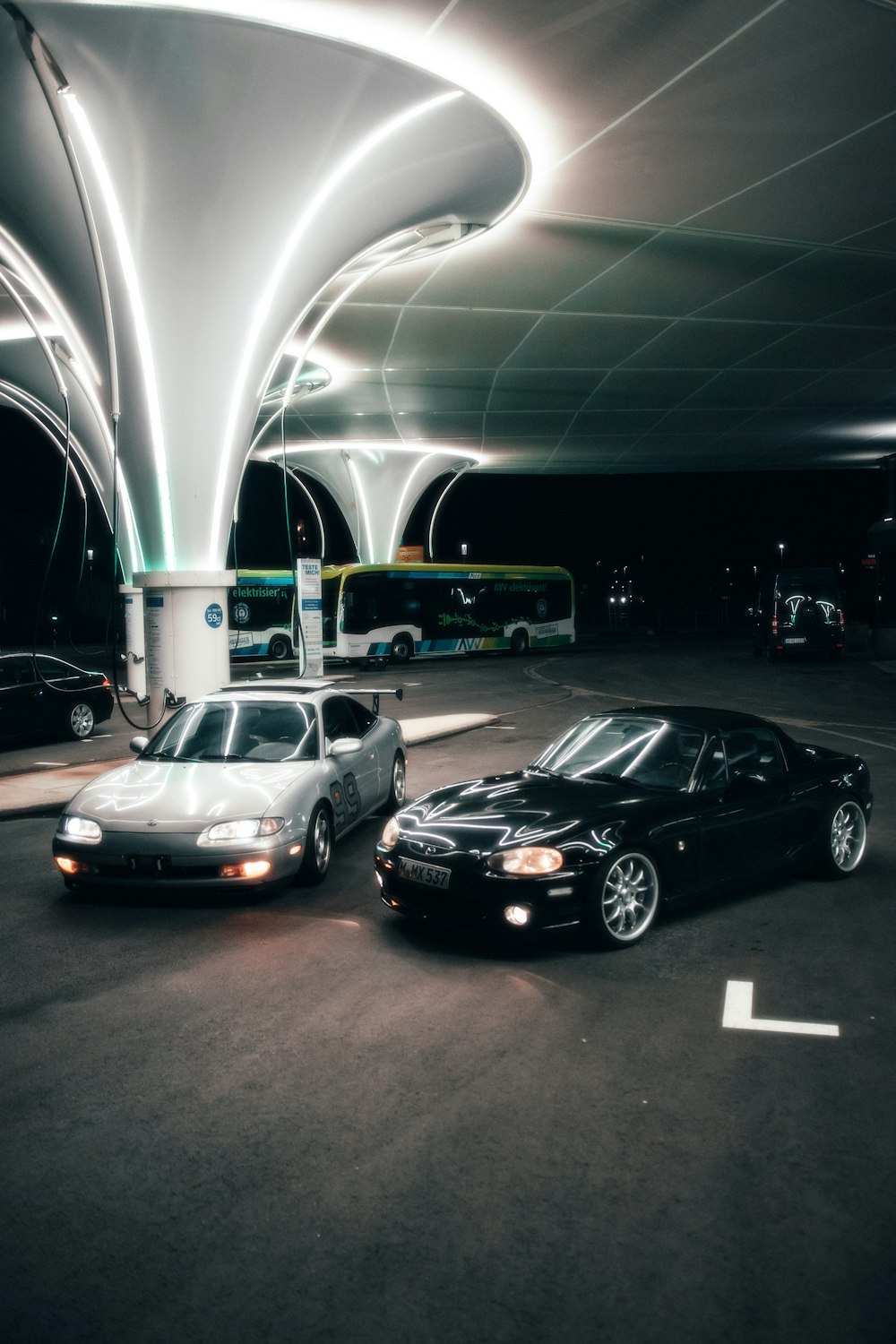 a couple of cars parked in a parking garage