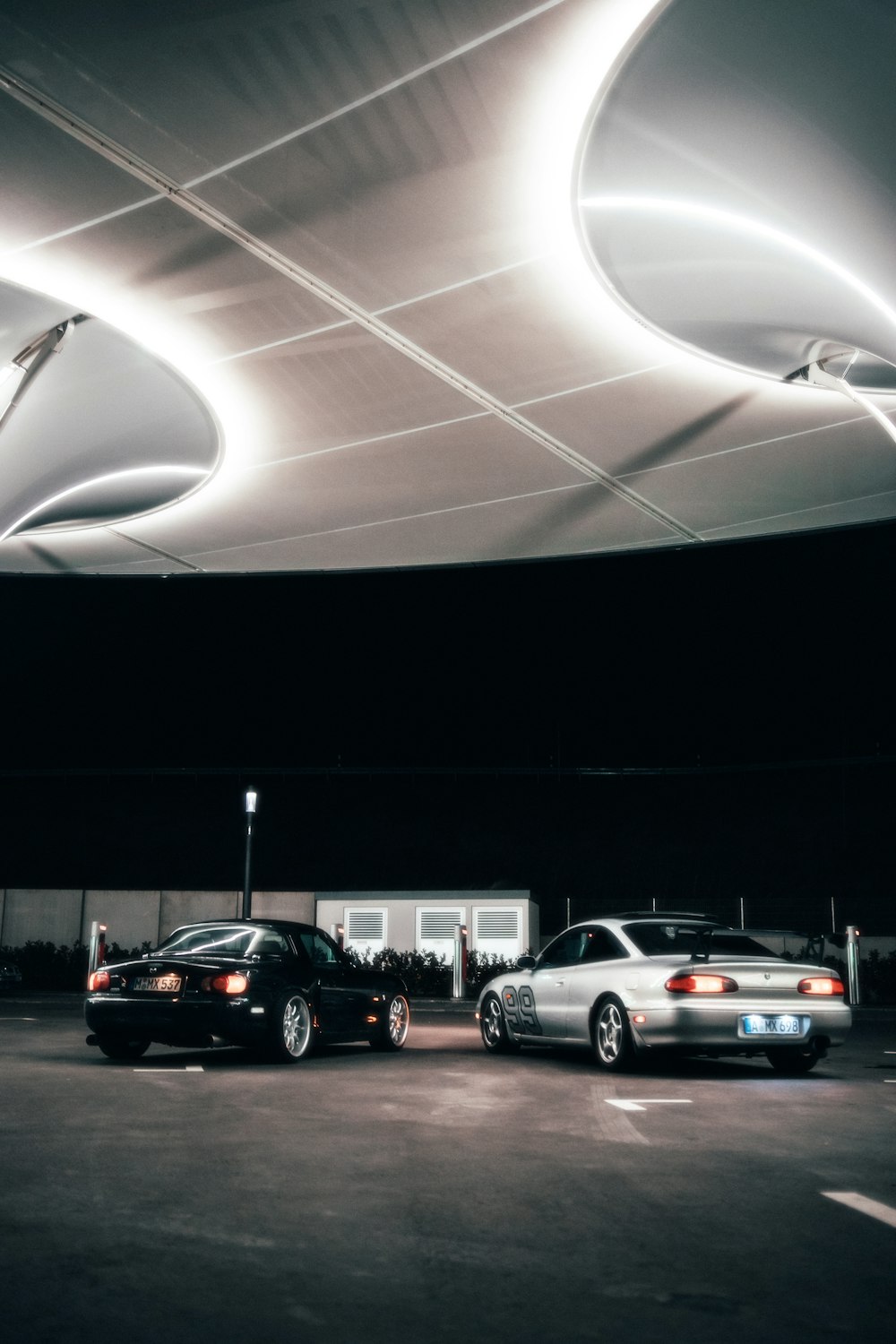 a couple of cars parked in a parking lot