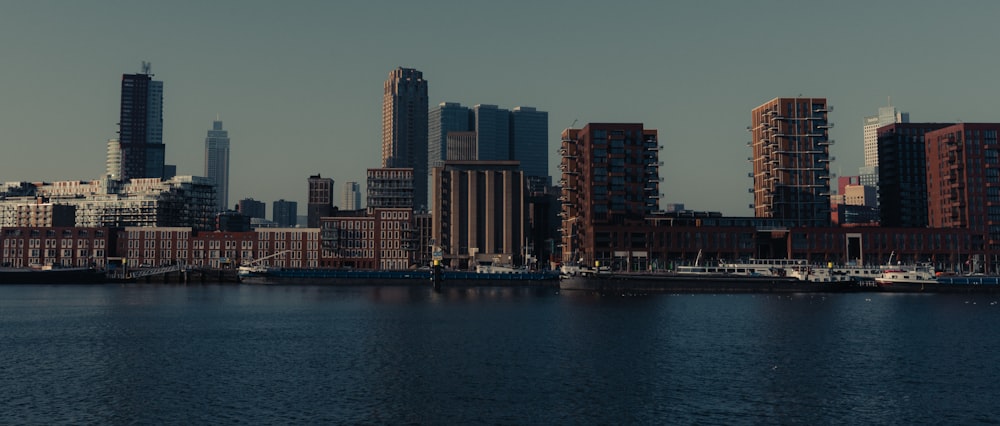 a large body of water with a city in the background