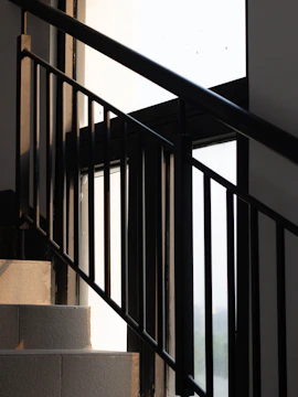 A dramatic architectural staircase bathed in soft natural light.