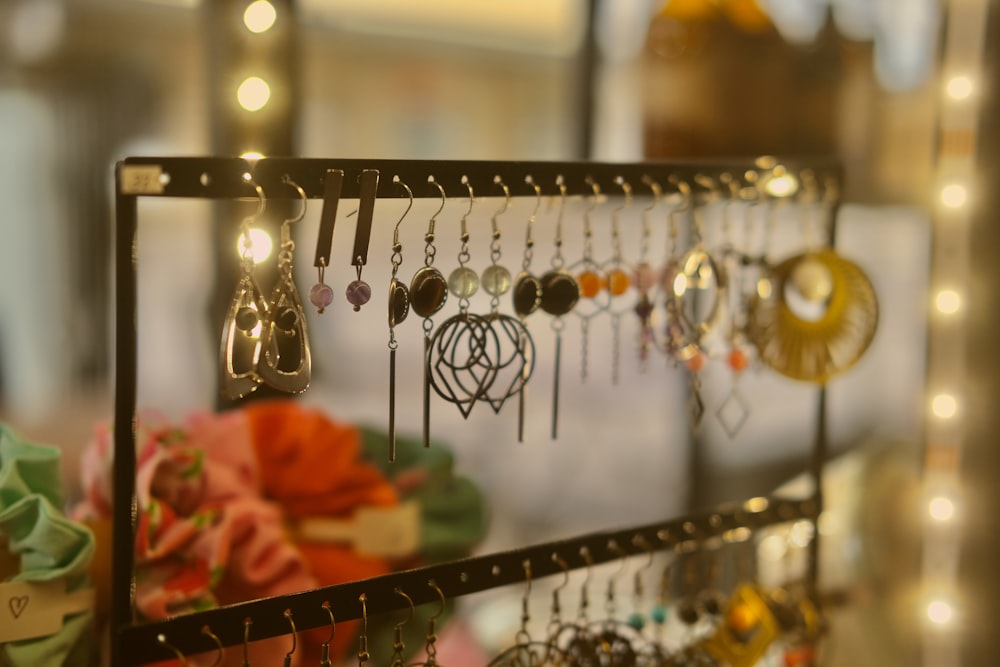 a rack with earrings hanging from it's sides