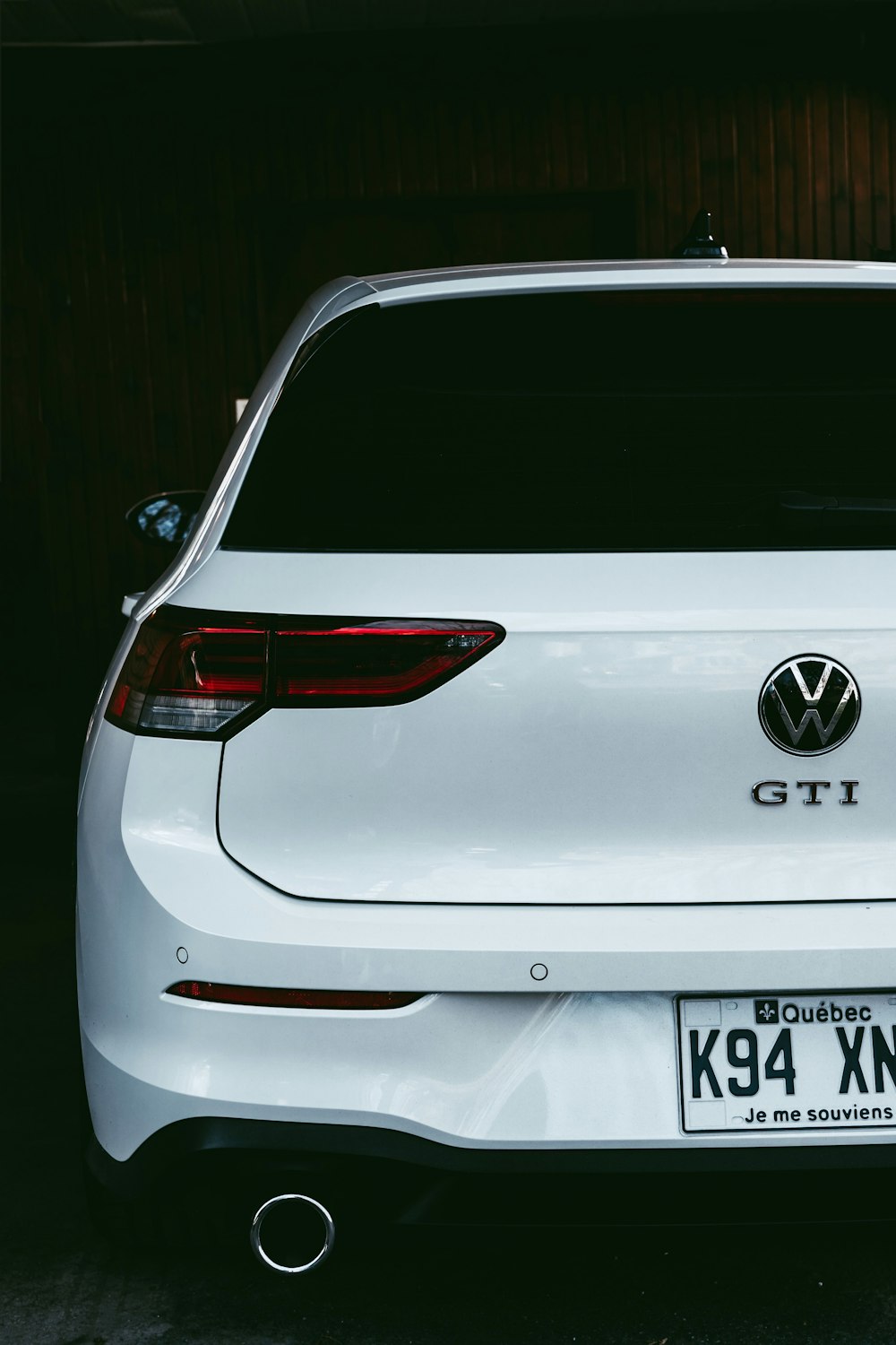 a white car is parked in a garage