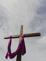 a cross with a purple cloth draped around it