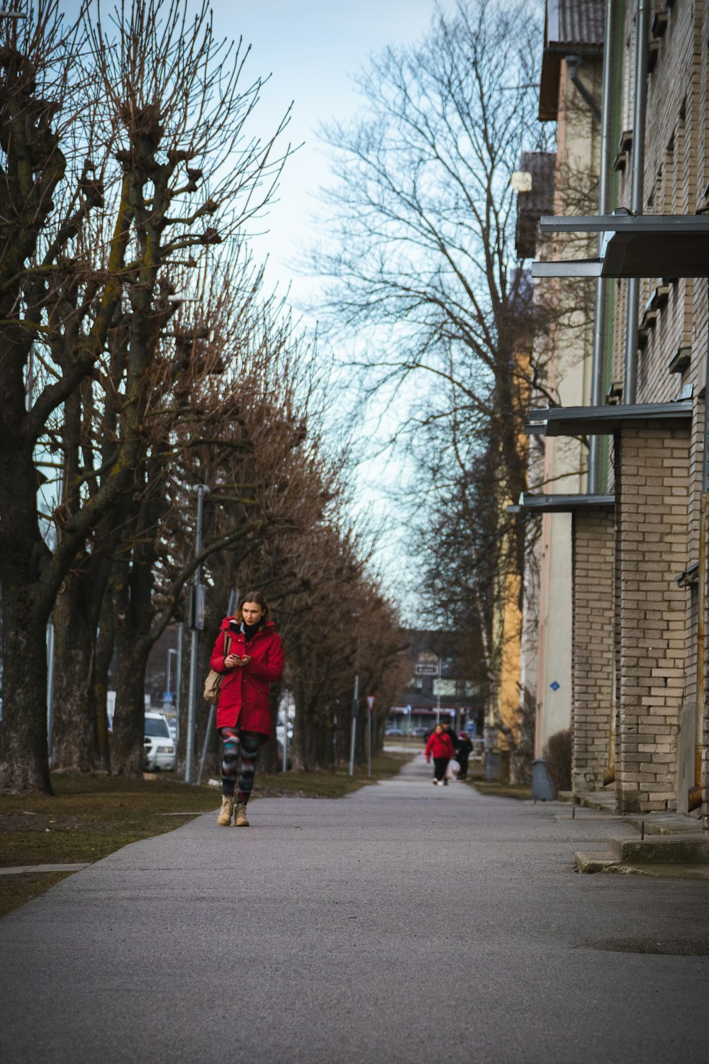 a person walking down a street with a skateboard