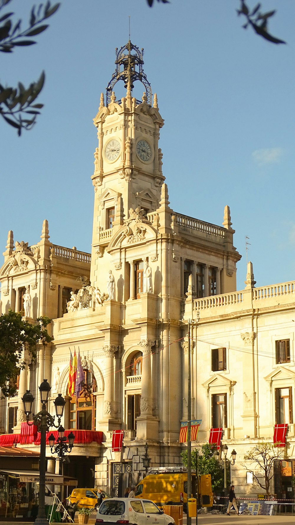 a large white building with a clock tower