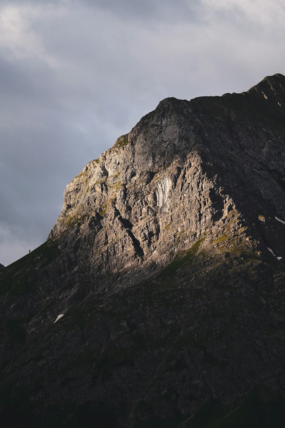 a very tall mountain with a sky background