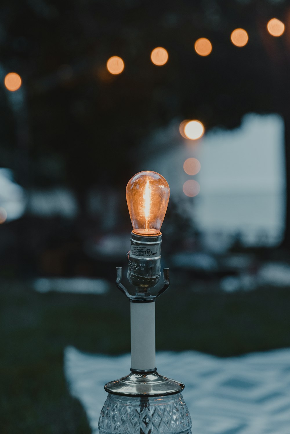 a light bulb sitting on top of a glass table