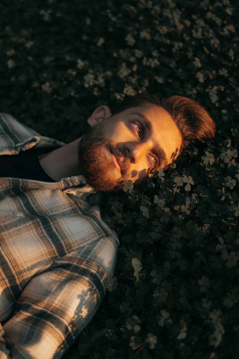 a man laying on the ground with his eyes closed