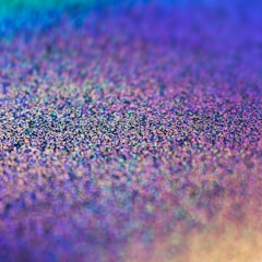 A close-up of textured film samples in various colors.