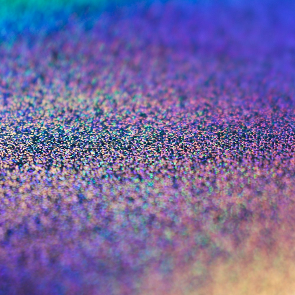 a multicolored background with small speckles