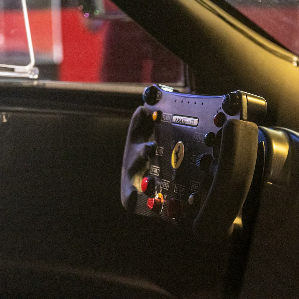 a car dashboard with a steering wheel and a dash board